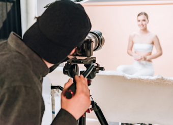 Male photographer taking photos of a face model