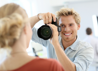 Male photographer taking face photos