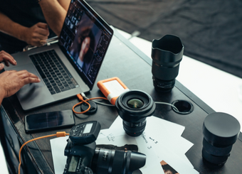 Photography equipment and a laptop placed on a table
