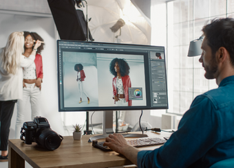 Photographer editing photo of a model