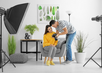 Photographer showing a photo taken by himself to a model