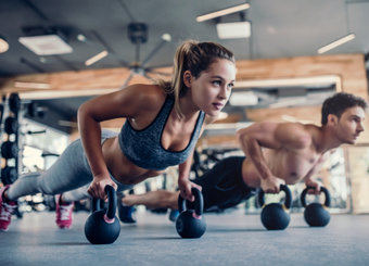 couple exercising at the gym