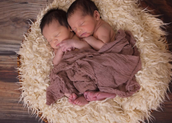 One of those baby photoshoot ideas is to put the infant or infants on a soft textured surface.
