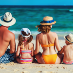 Photo of a family sitting in the beach